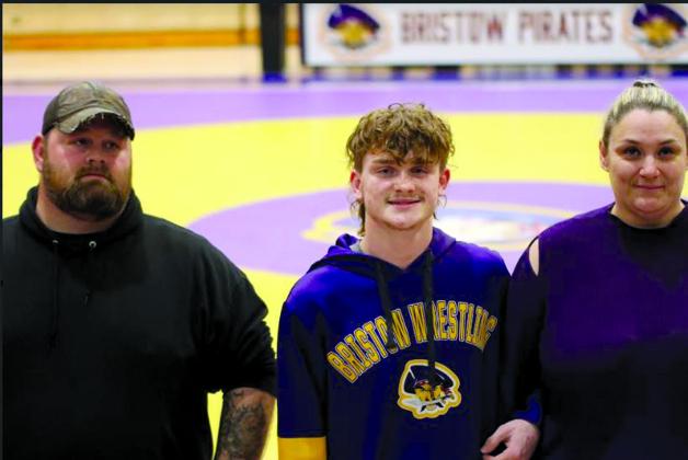 TJ Holt with father Jessie Holt and stepmother Ashley Hubbard.