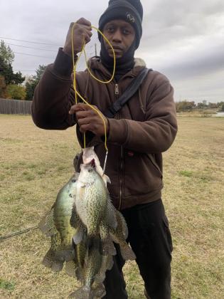 Terry Taylor with a stringer of crappie caught in Oklahoma County.