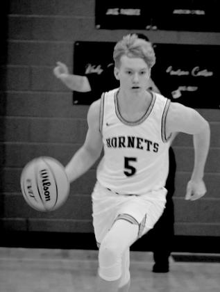 Jesse Smith dribbles down court.