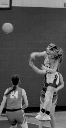 Lillian Thatcher jumps for the ball.