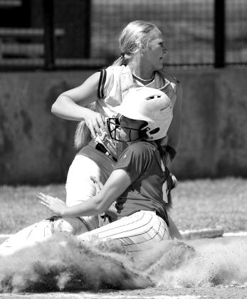 McCloud’s Elexias Patterson brought in a cloud of dust but Lady Pirate catcher Liz Waltrip still got the out.