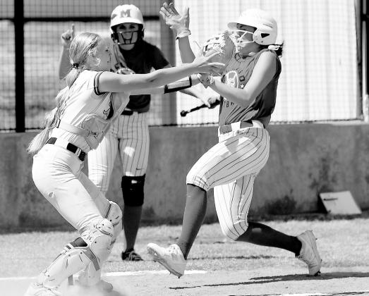 Lady Pirate catcher Liz Waltrip tags McCloud’s Alvia Scott for the out.