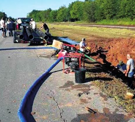 Workers worked deligently to restore water to the city on Saturday. courtesy photo