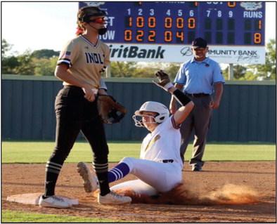 Abby Morgan safely slides into third.