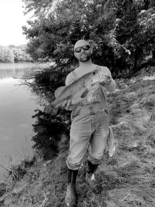 Thomas Madden with a largemouth bass.