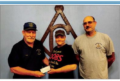 Gene Wood presenting a check to Lynn Hopkins Smith with Robert Saul. courtesy photo