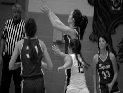Katrina Ash, Lauren Carrie and Samantha Peeler make the play.