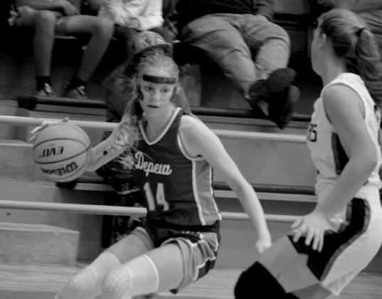 Lillian Thatcher takes the ball down court.