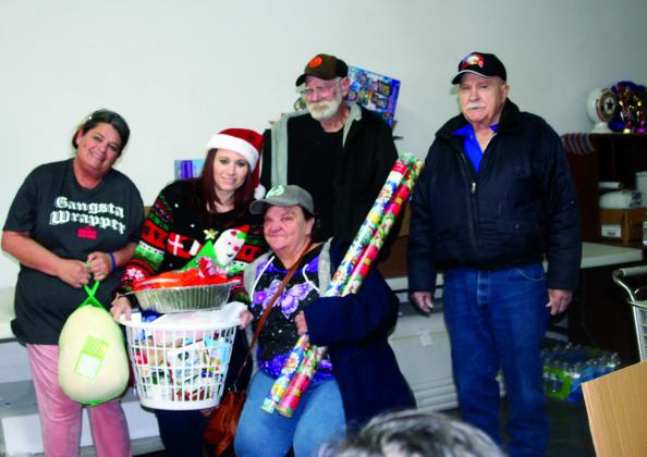 Pictured are Teresa Coker, MJ Mayes, president of the American Legion Auxilary, Teresa Livesey and Elvin Anderson, commander..