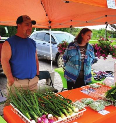 Shane and Sharla Bowling show some of the fresh vegetables they grow. courtesy photo