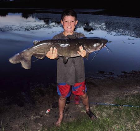 Jase R. with a channel catfish caught in Carter County courtesy photo