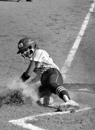 Emily Moore slides in to base.