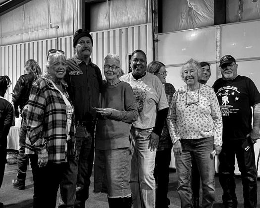 Winners of the Hawg Wild Run 50/50 drawing were Diana and Sonny Roberts, who after winning, donated the winnings back to the social serices. Pictured from left, Diana Roberts, Sonny Roberts, Sharon VanOrsdol, Toni Godwin, Katie Anderson, Nancy Grieves, Kim England and JR Kennedy.