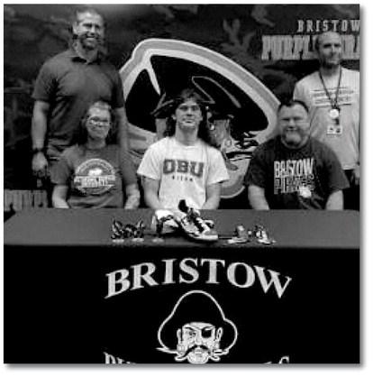 Bristow Pirate Gage Spencer, shown with his parets Joseph and Michelle Spencer, recently signed with Oklahoma Baptist University to continue his journey as a track and field athlete. courtesy photo