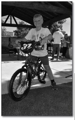 Joel McDaniel looks thrilled after winning a bike.