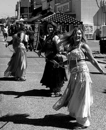 Members of the Mirage Dance Company performed with canes, swords and ribbons while belly dancing to Middle Eastern music. A few girls in the audience joined the dancers.