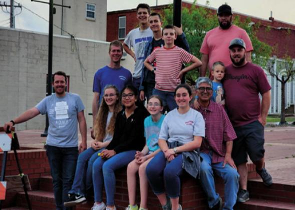 The Pathfinder Club during depot cleanup. Front row from left, Pastor Andew Spooner, Mackenzie Grigsby, Evaline Braden, Skyler Grigsby, Addison Braden and Gilbert Perez. Back row from left, Andrew Fisher, Zach East, Enock Spooner, Jonah Spooner, Quinton Braden and Trevor Grigsby. courtesy photo
