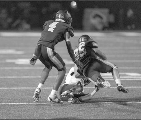 TJ Wilson and Haydan Yocham tackle the opponent.