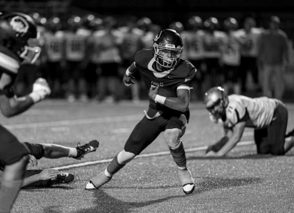Roan Goodwin punts the ball.