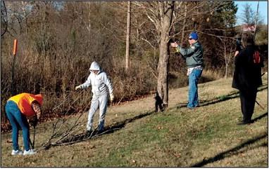 Bristow Garden Club members Mary Stubblefield, Carolyn Kuykendall, David Ray, and Sheryl Cortez removing tree suckers.