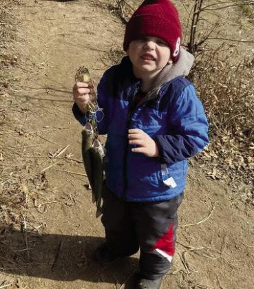 NobleRussellisproudofhisrainbowtroutcatch.