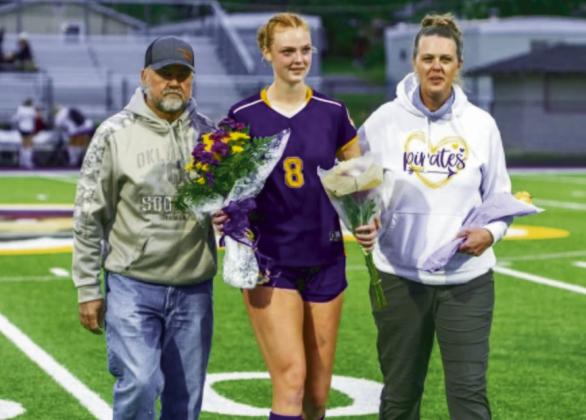 Dustee Thompson being escorted by Scott and Christie Thompson