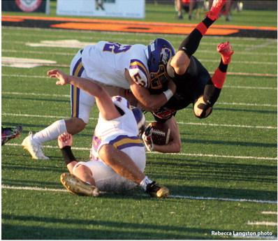 Rebecca Langston photo Parker Ledbetter takes down a Cushing Tiger with the help of #44 Talon Bigpond.