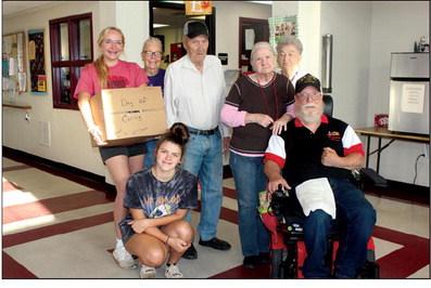 Abby Morgan, Lani Morrow and Sharon VanOrsdol, delivered a case of coffee, donated by Mc-Donalds, to the senior nutrition center. Angie Gentry photo