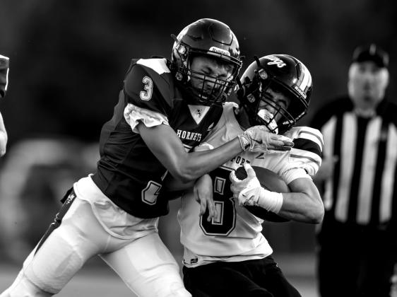 Wyatt Osburn takes the opponent out of bounds.
