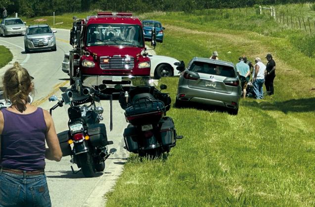 Motorcycle crash sends woman to hospital
