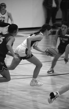 Katrina Ash dribbles towards the hoop. courtesy photo