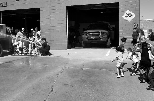 courtesy photo Thrilled with the cool mist of the water hose.