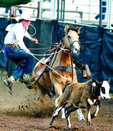 Colby Palmer from Bristow during calf roping Thursday night at the rodeo in Shawnee. Brian Blansett photo