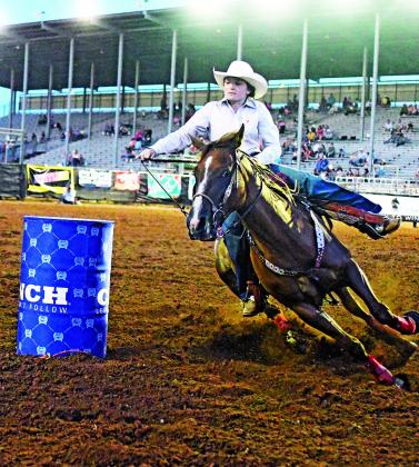 Jentezen Smith photo Audrey Sauter in barrel racing Thursday night at the rodeo in Shawnee.