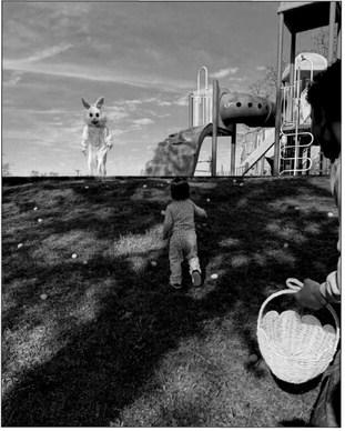 Little Adalyn decided she would rather run up the hill to the Easter Bunny than gather the eggs. photo courtesy of Sharon VanOrsdol
