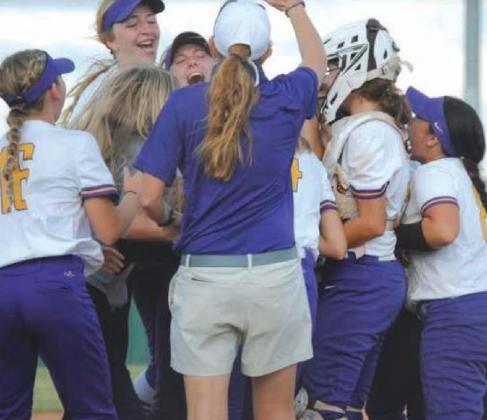 Coach Robison and team celebrates the regional win. courtesy photo