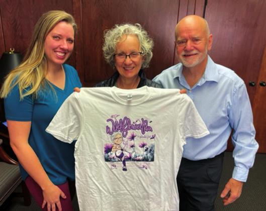 Last week, Chip Cooper and Tanya Miller presented Kris Wyatt with the 34th annual Wildflower Run t-shirt. courtesy photo
