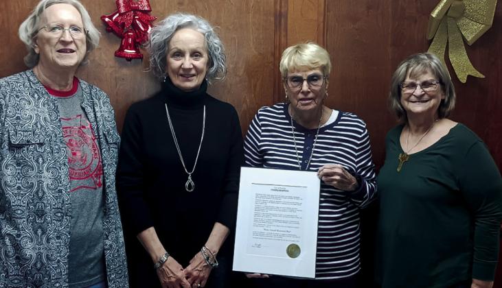 Virginia Ray, VFW Auxiliary President Ruth Jaytanie, and Margaret Foster receiving the Wake Island Memorial Day proclamation from Mayor Kris Wyatt. courtesy photo