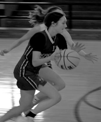 Lauren Carrie takes the ball down court.