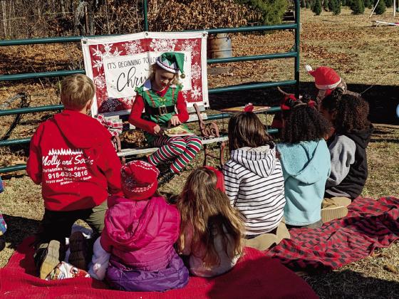 Riley Brden, led Storytime at Molly and Socks Market/Christmas Tree Farm on Friday and Saturday. Santa will be at Molly and Socks on Saturday, December 2 from 11 a.m. to 1 p.m. courtesy photo