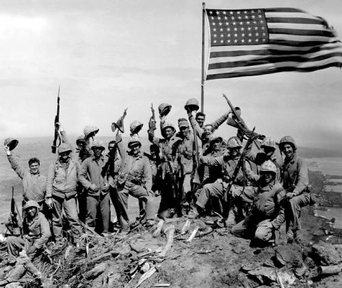 Soldiers raising the flag in World War !!.