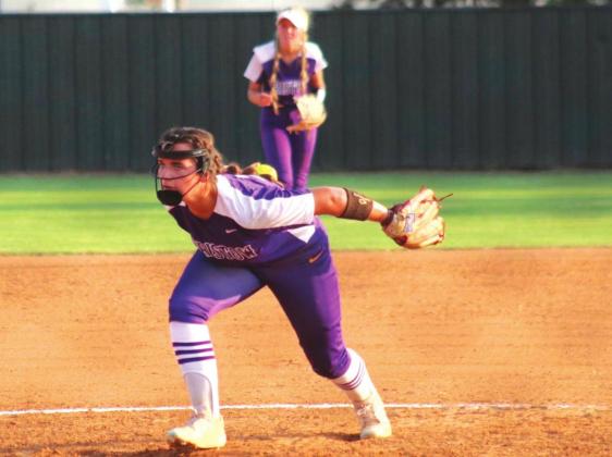 McKenna Ingram delivers the pitch with Graycie Gramm on defense.