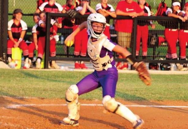 Lacey Moody looking to pick off a Fairland runner.