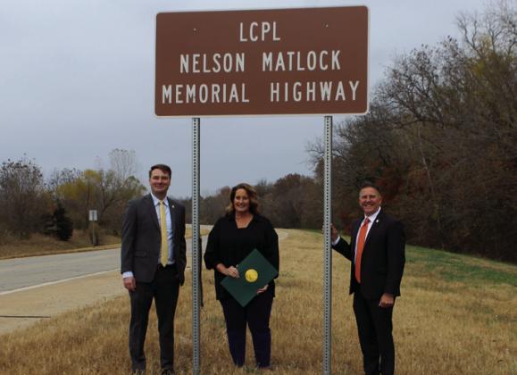 L-R Speaker Pro Tempore Kyle Hilbert, LCpl. Nelson Matlock's daughter Cindy Matlock Bobo, and Sen. Todd Gollihare; Vicki Grisham photo