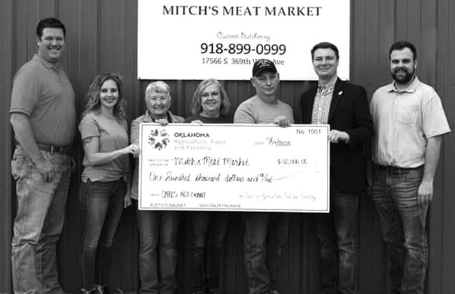 Oklahoma Department of Agriculture Food and Forestry presents checks from Cares Act