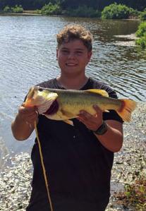 Caeden G. with a largemouth caught in Lincoln County.