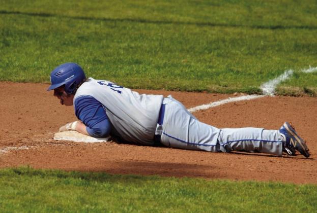 Christopher White slides to the base. courtesy photo