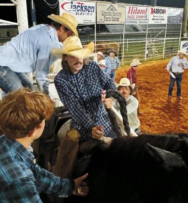 Brian Blansett photo Tri-County Herald Parker Cassidy, from Bristow, nods his head for the gate to open in the ranch bronc riding on Friday night.