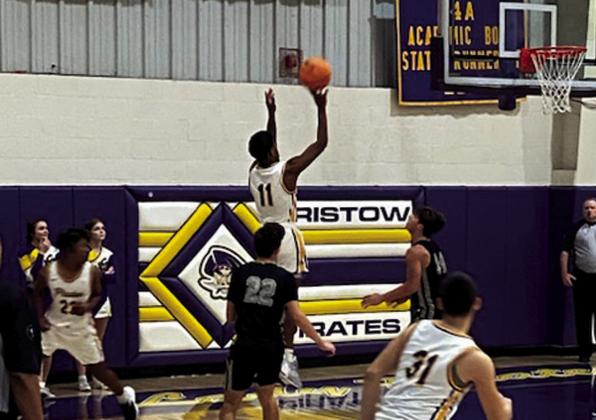 Memphis Deshazo and DJ Allen guard as Calen Alexander scores the points. courtesy photo