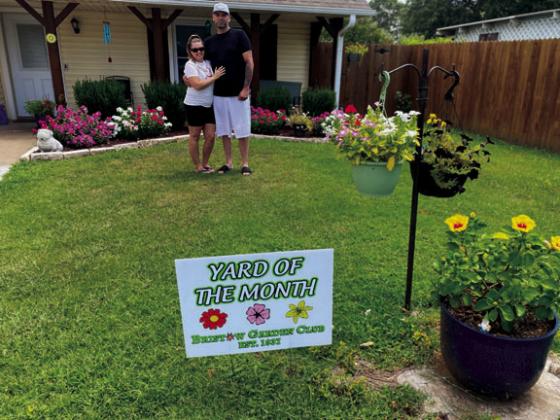 The Bristow Garden Club’s Yard of the Month for August goes to Josh Titus, 111 North Oak Street. Josh is shown here with his daughter Jayla. courtesy photo